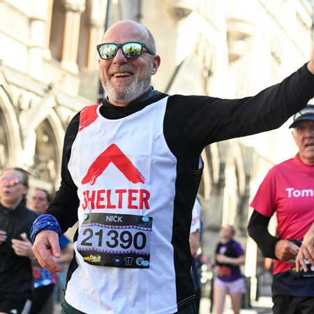 Man running a marathon for Shelter