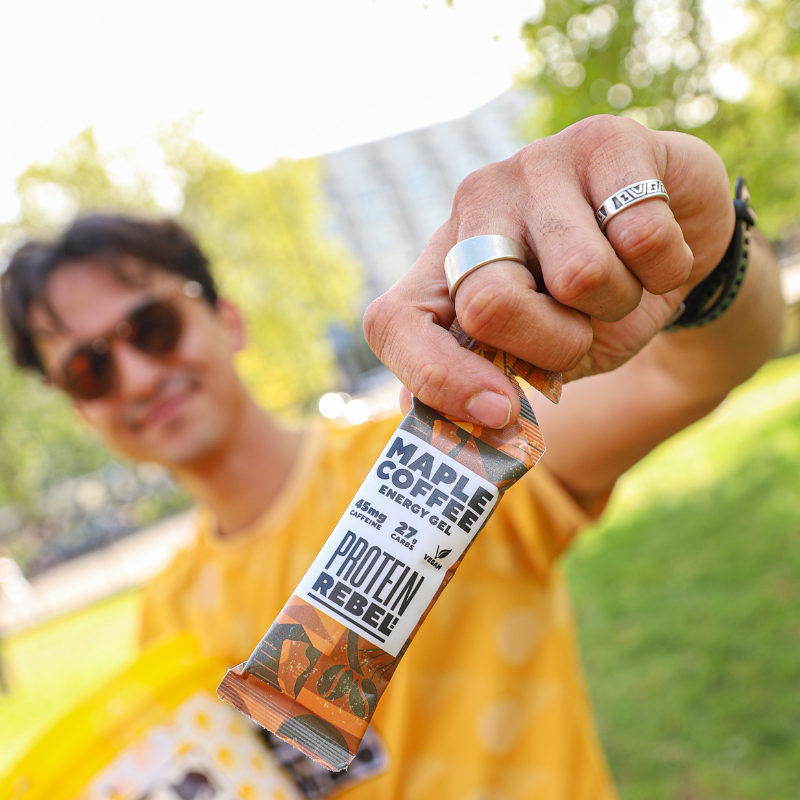 Save the Rhino runner hold a Maple Coffee Protein Rebel bar.