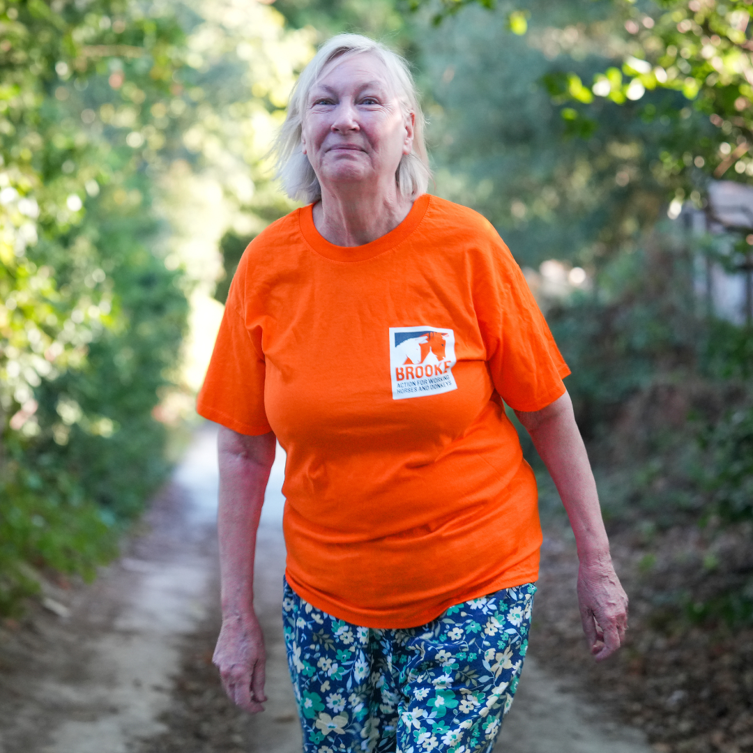 Brooke supporter in orange t-shirt walking